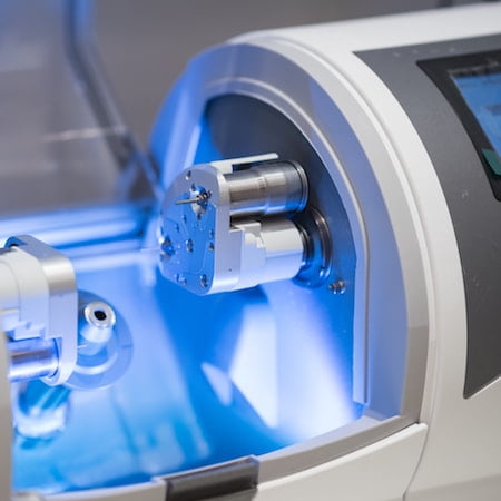 Seattle Dental Services offers CEREC same-day technology using a milling machine